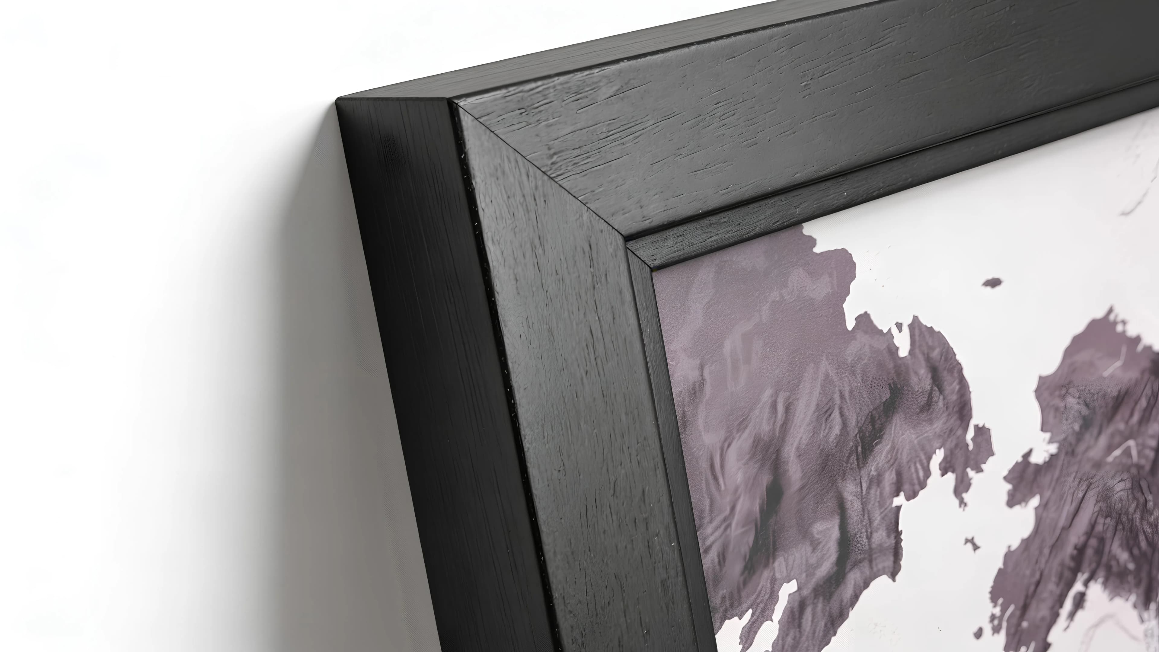 Macro of the precision-mitred corner in solid black hardwood